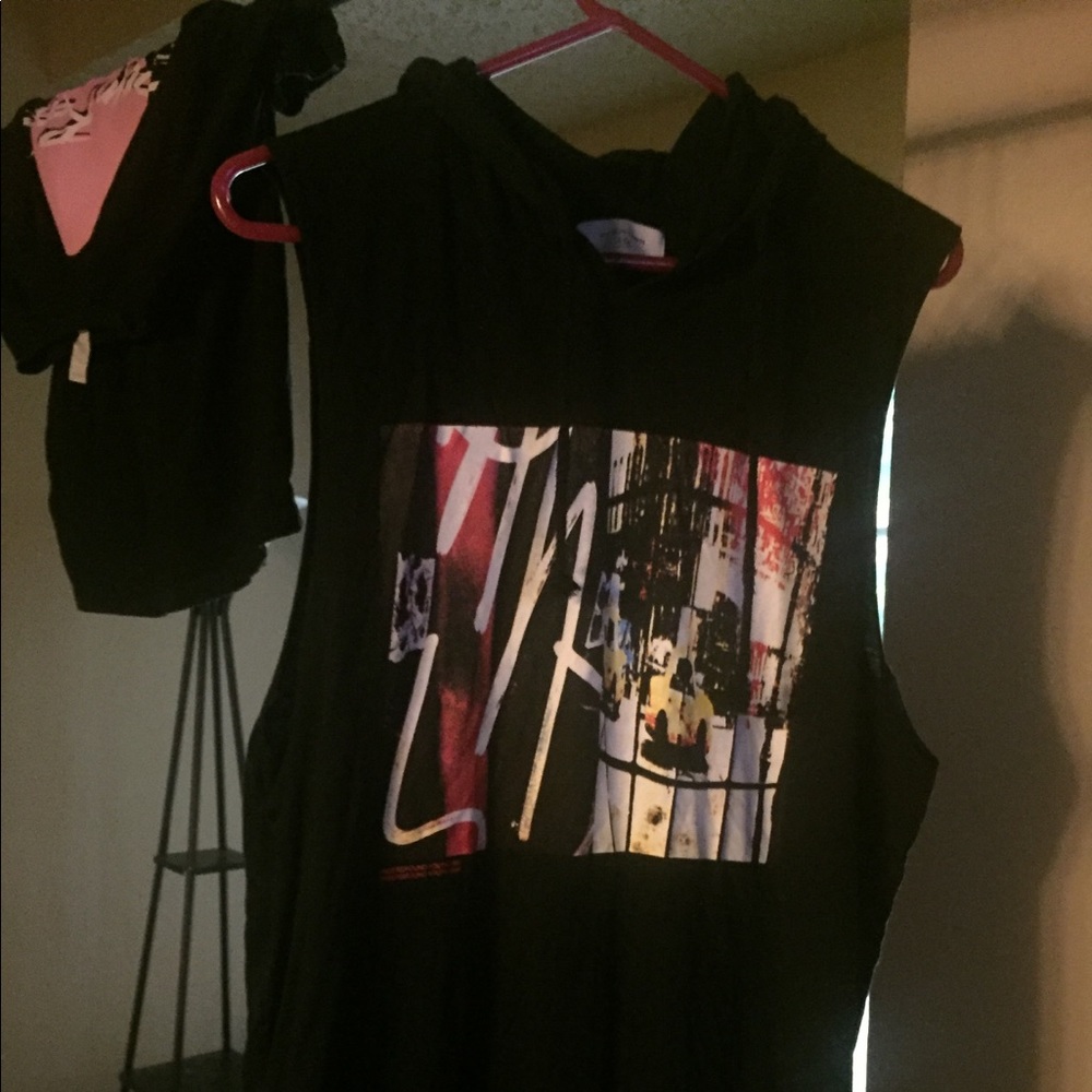 Imaged sleeveless black hoodie.